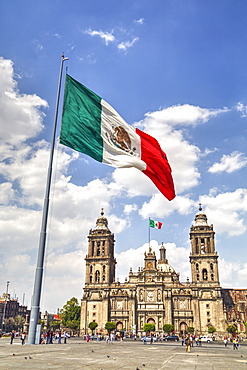 Mexican flag, Plaza of the Constitution (Zocalo), Metropolitan Cathedral in background, Mexico City, Mexico D.F., Mexico, North America