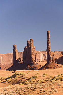 Afternoon view of the Totem Pole rock formation on the right and Yei Bi Chei on the left, Monument Valley Navajo Tribal Park, Utah, United States of America, North America