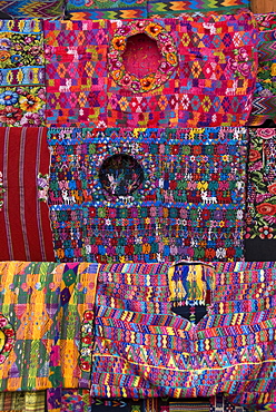 Traditional huipils (square cut blouses) for sale in the market, Chichicastenango, Guatemala, Central America