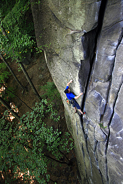 A climber scales the cliffs above Cadarese, northern Italian Alps, Italy, Europe