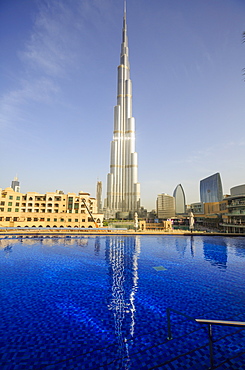 Burj Khalifa reflected in hotel swimming pool, Dubai, United Arab Emirates, Middle East 