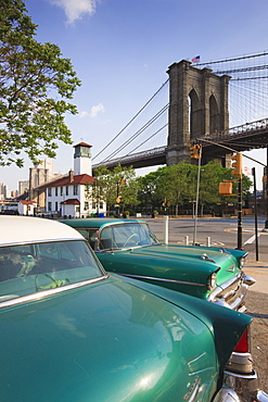 Two 1950's cars parked near the Brooklyn Bridge at Fulton Ferry Landing, Brooklyn, New York City, New York, United States of America, North America