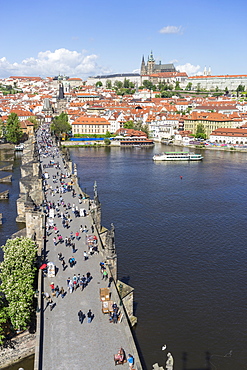 High angle view of Charles Bridge looking towards the Castle District, Royal Palace and St. Vitus's Cathedral, UNESCO World Heritage Site, Prague, Czech Republic, Europe