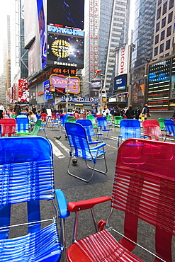 Garden chairs in the road for the public to sit in the pedestrian zone of Times Square, Manhattan, New York City, New York, United States of America, North America