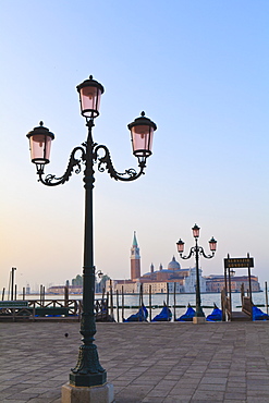 Gondolas moored by Riva degli Schiavoni, looking towards San Giorgio Maggiore, Venice, UNESCO World Heritage Site, Veneto, Italy, Europe