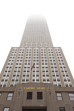 Empire State Building shrouded in mist, Manhattan, New York City, New York, United States of America, North America