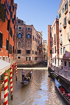 A gondola on a canal in Venice, UNESCO World Heritage Site, Veneto, Italy, Europe