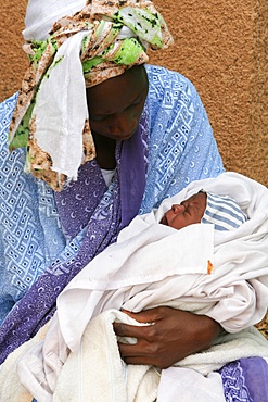 Mother holding her crying baby, Keur Moussa, Senegal, West Africa, Africa