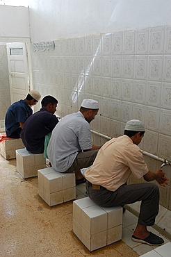 Muslim medersa students washing before prayer, Nouiel, Kebili, Tunisia, North Africa, Africa