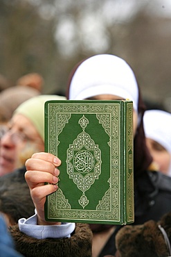 Koran being held during a Muslim demonstration, Paris, France, Europe