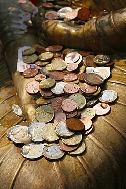 Coin offering at the Vincennes Buddhist Pagoda, Paris, France, Europe