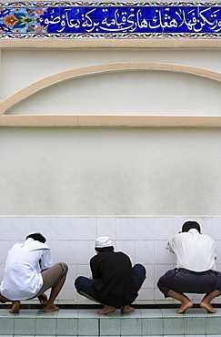 Washing before prayers, Masjid Kampung mosque, Kuala Lumpur, Malaysia, Southeast Asia, Asia