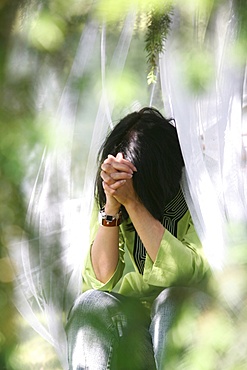 Woman praying, France, Europe