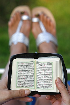 Woman reading Koran