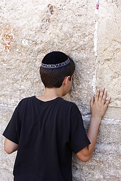 Boy praying at the Western Wall, Jerusalem, Israel, Middle East