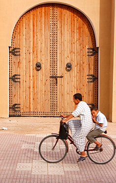 Father and son on bicycle, Taroudan, Morocco, North Africa, Africa