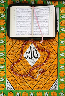 Koran, rosary and Allah calligraphy, Paris, France, Europe