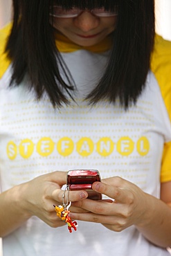 Young woman with mobile phone, Seoul, South Korea, Asia