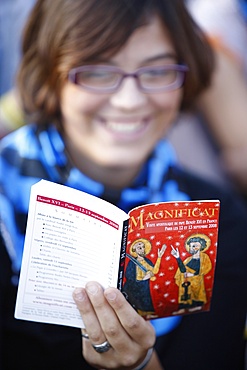 Woman reading a Catholic prayer book, Paris, France, Europe