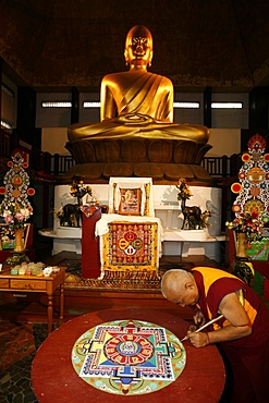 Buddhist monk drawing a mandala, Paris, Ile de France, France, Europe