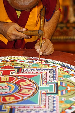 Buddhist monk drawing a mandala, Paris, Ile de France, France, Europe