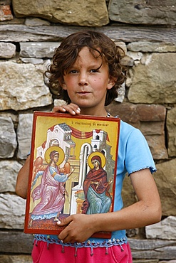 Orthodox child holding an icon, Sheltzan, Elbassan, Albania, Europe