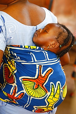 African mother carrying her baby on her back, Lome, Togo, West Africa, Africa