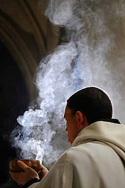 Monk holding an incense bowl during an Ecumenical celebration, Paris, France, Europe