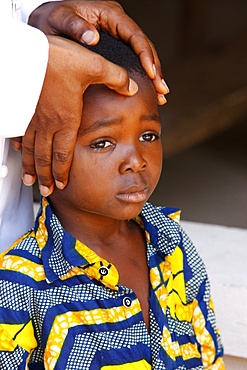 African child blessed by a priest, Lome, Togo, West Africa, Africa