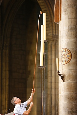 Lighting candles, Notre Dame de Paris Cathedral, Paris, France, Europe