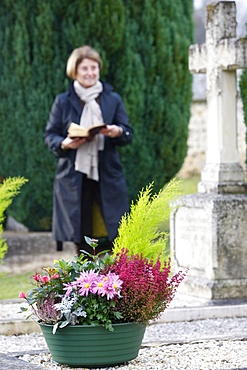 Woman in cemetery, Saint-Antonin-de-Sommaire, Eure, France, Europe