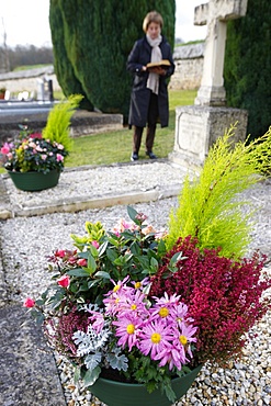 Woman in cemetery, Saint-Antonin-de-Sommaire, Eure, France, Europe