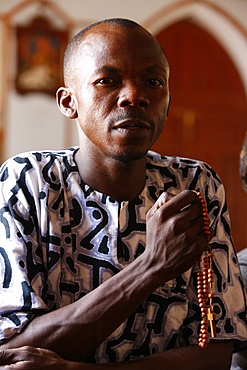 Christian man praying, Togoville, Togo, West Africa, Africa