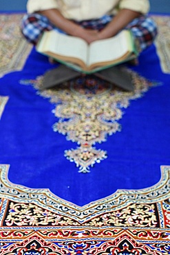 Muslim man reading the Quran in a mosque, Ho Chi Minh City, Vietnam, Indochina, Southeast Asia, Asia