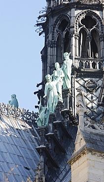 Statues of three apostles at the foot of Notre-Dame-De-Paris cathedral spire, Paris, Ile de France, France, Europe