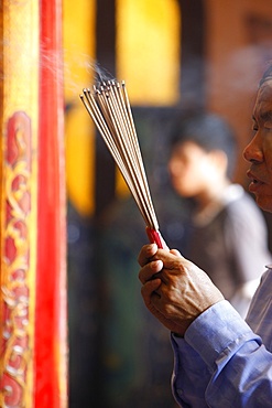 Burning incense during Tet, the Vietnamese lunar New Year celebration, Thien Hau Temple, Ho Chi Minh City, Vietnam, Indochina, Southeast Asia, Asia