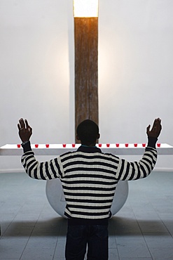 African man  in a church, Paris, France, Europe