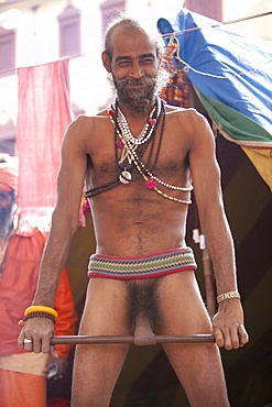 Sadhu, a naked Baba, belonging to the Junna brotherhood, practising a penis exercise to show his spiritual strength at the Kumbh Mela in February 2010, Haridwar, Uttar Pradesh, India, Asia