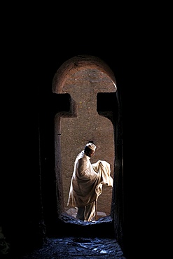 Man entering Bet Medhane Alem church in Lalibela, Wollo, Ethiopia, Africa