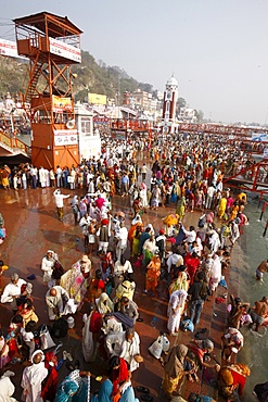 Thousands of devotees converge to take a dip in the River Ganges at Navsamvatsar, a Hindu holiday during the Maha Kumbh Mela festival, Haridwar, Uttarakhand, India, Asia