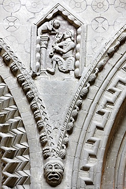 A 12th century corner stone depicting a man performing with a monkey, Notre Dame de Bayeux cathedral, Bayeux, Normandy, France, Europe