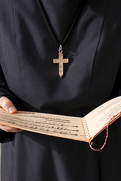 Catholic nun holding a music sheet, Annecy, Haute-Savoie, France, Europe