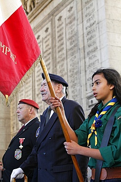 French Muslim girl scout and war veterans at the Arc de Triomphe, Paris, France, Europe