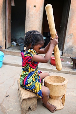 Girl pounding food, Lome, Togo, West Africa, Africa