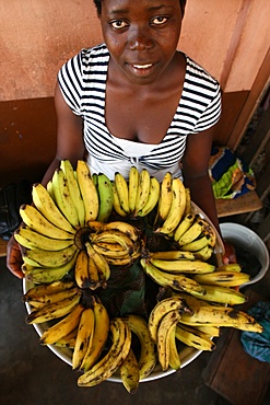 Girl selling bananas, Lome, Togo, West Africa, Africa