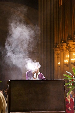 Archbishop censing the altar of Notre Dame Cathedral, Paris, France, Europe