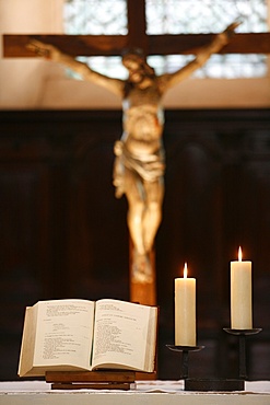 Bible and altar candles, Vienne, Isere, France, Europe