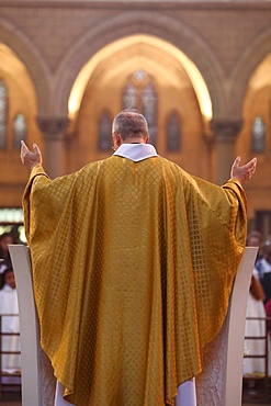 Priest during Eucharist celebration, Paris, France, Europe