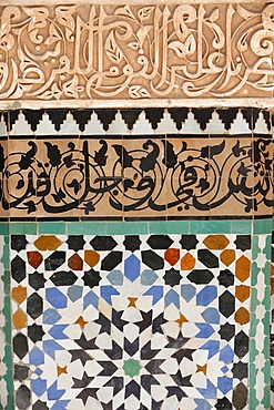 Detail of calligraphy and zellij in the patio, Ben Youssef Meders, the largest Medersa in Morocco, originally a religious school founded under Abou el Hassan, UNESCO World Heritage Site, Marrakech, Morocco, North Africa