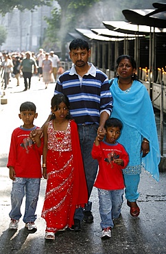 Tamil family at the Lourdes shrine, Lourdes, Hautes Pyrenees, France, Europe